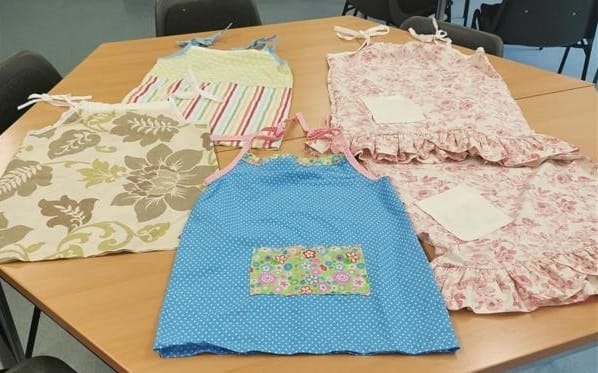 Sample of Pillowcase Dresses displayed on table.